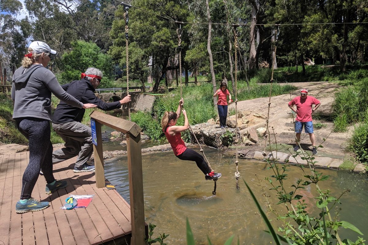 Corporate team participating in a team-building activity at Woodhouse