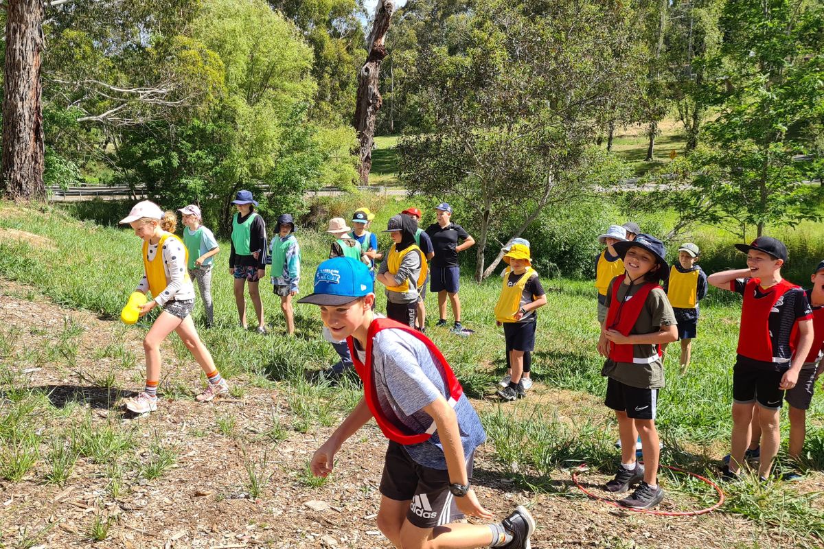 Children playing outdoor group games at Woodhouse