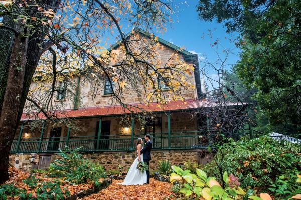 Bride and groom outside Old Woodhouse Manor