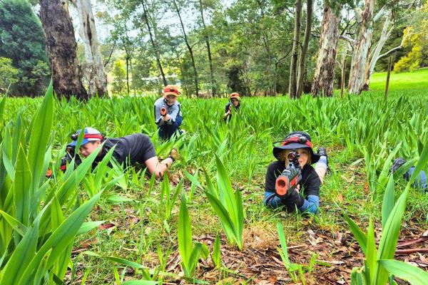School children playing outdoor laser skirmish at Woodhouse Adventure Park